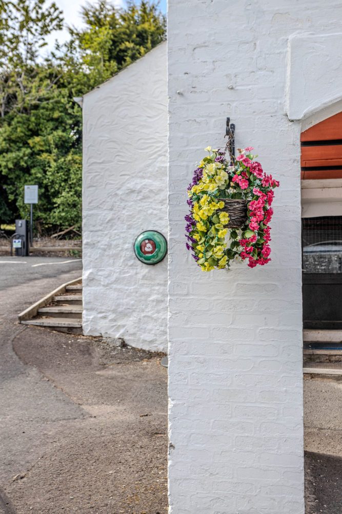 reception and EV charger in car park
